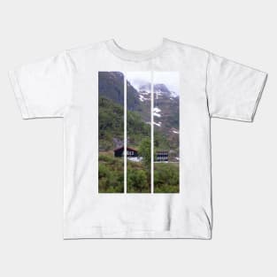 Wonderful landscapes in Norway. Vestland. Beautiful scenery of houses with grass roof. Norwegian traditional architecture Mountains, trees and snow in background. Cloudy day (vertical) Kids T-Shirt